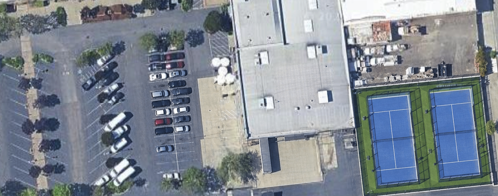 Overhead property view with numbered locations: four exterior parking spaces, gated parking, the office and two courts